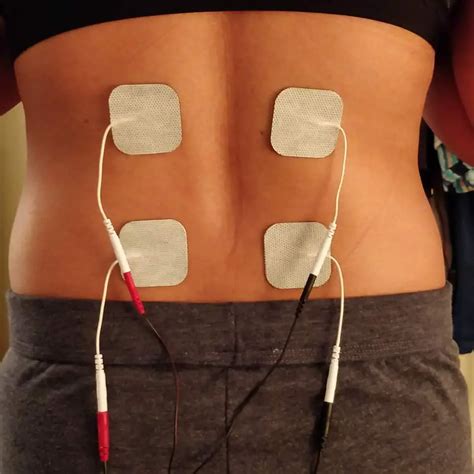 Not lying down when massaging neck. . Why is my tens unit shocking me